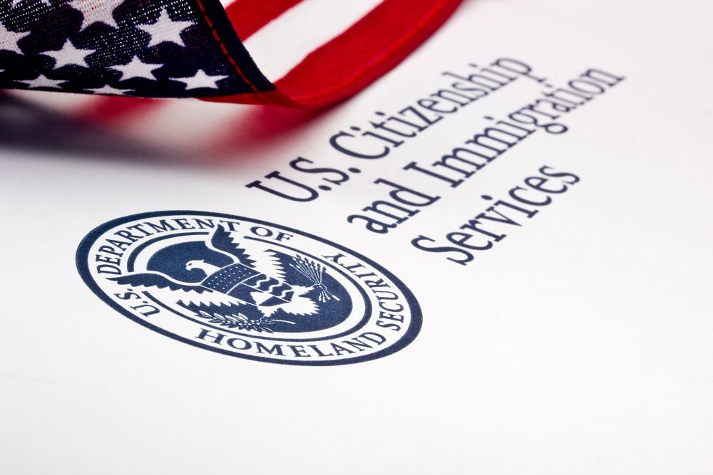 USCIS logo and American flag